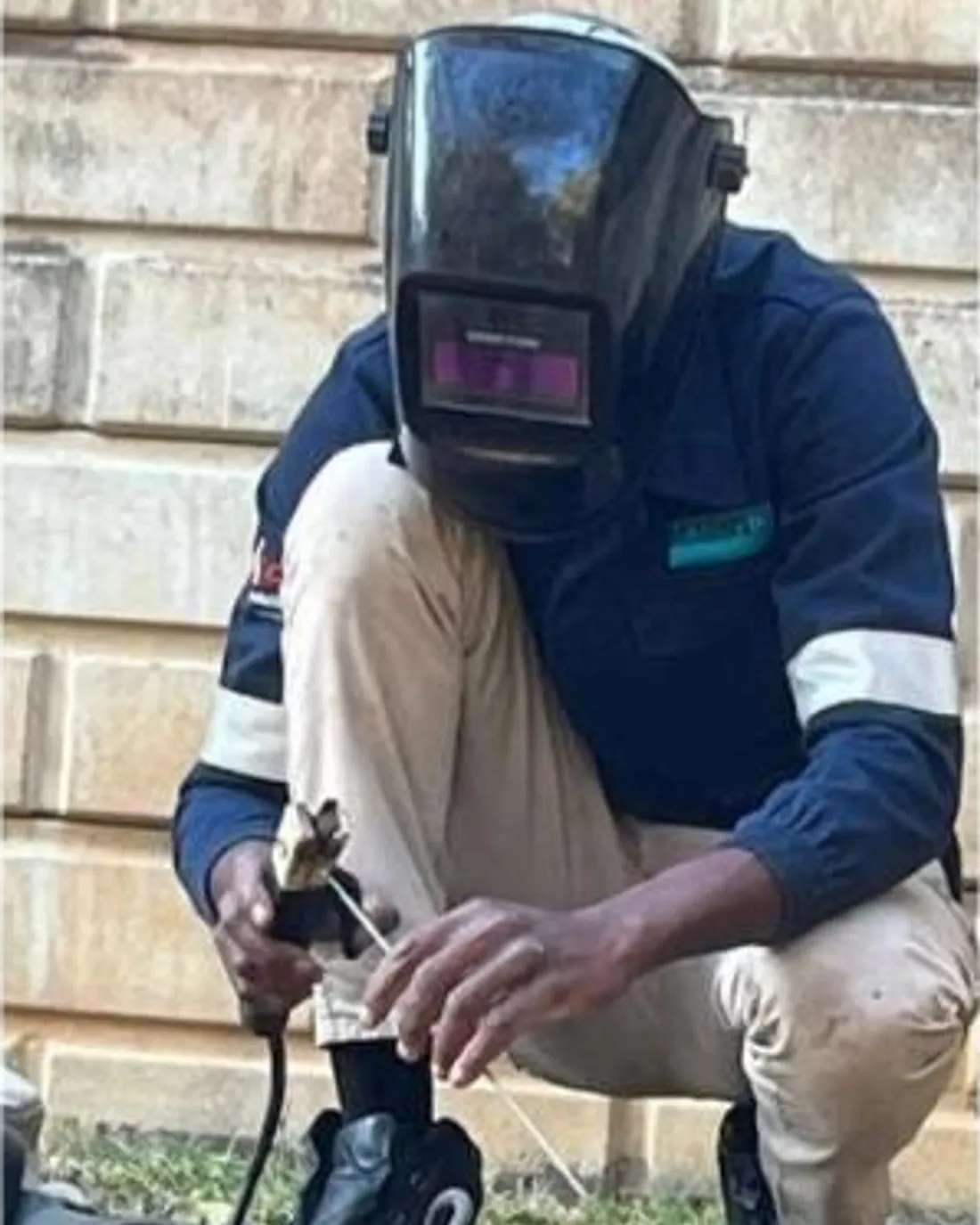 Godern Nyoni, founder of Gifted Hands Welding & Fabrication, welding on site in Fourways